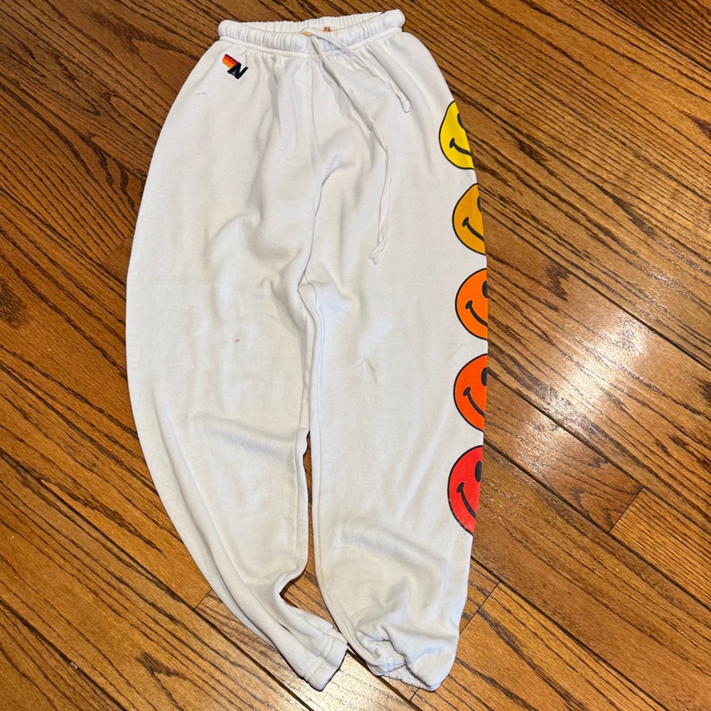 Aviator Nation White Sweatpants with Yellow-Orange-Red Gradient Smiley Faces